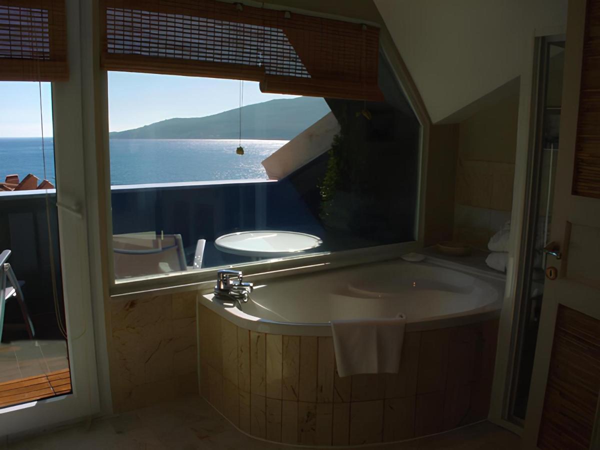 Suite mit Kingsize-Bett und Whirlpool