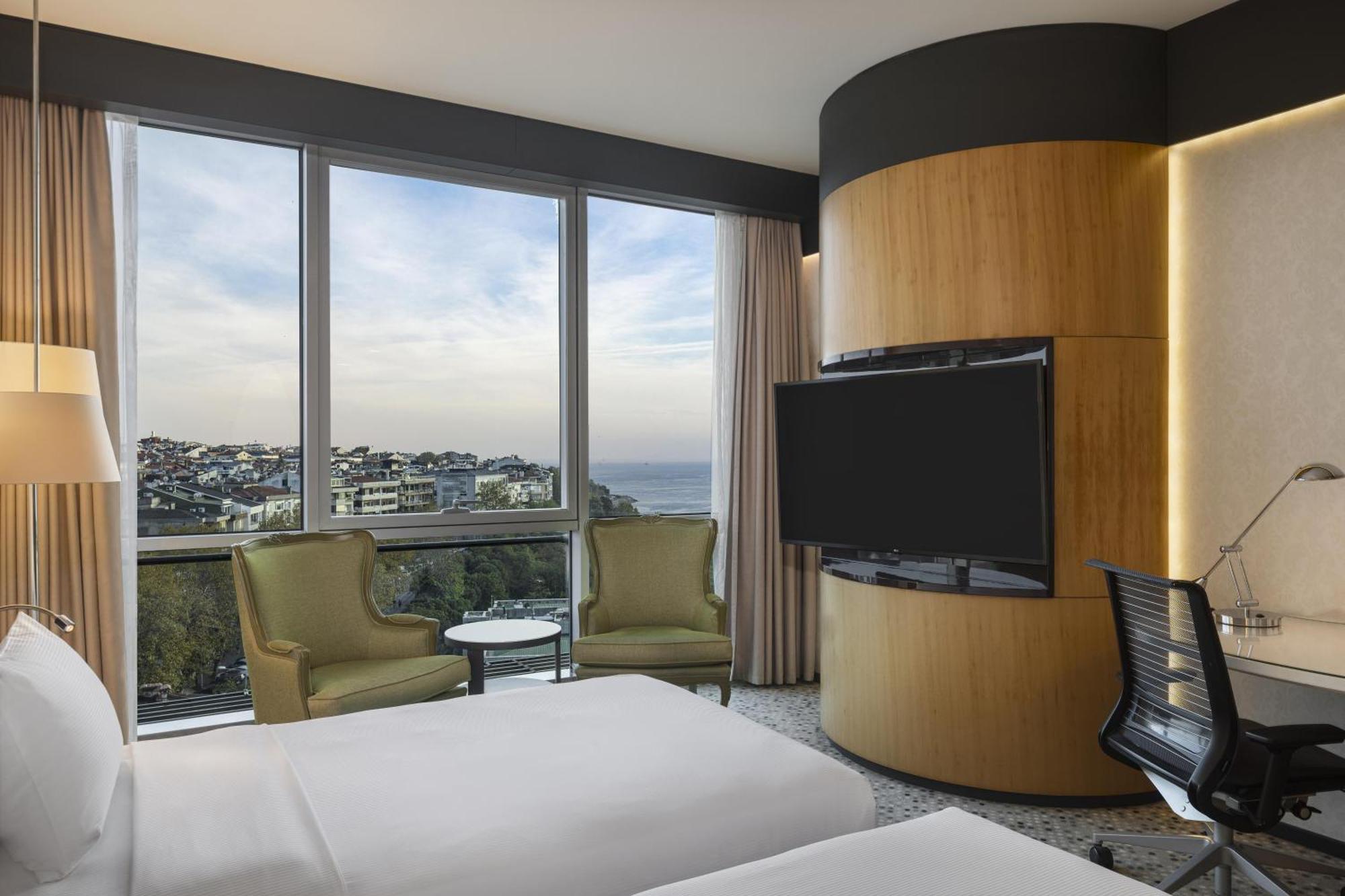 Habitación Doble Deluxe con vistas parciales al mar - 2 camas
